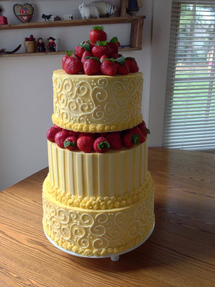 yellow wedding cake with strawberries.jpg
